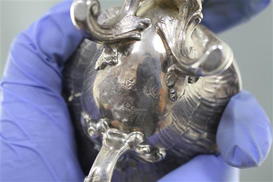 An 18th century French rococco white metal double salt, with hinged covers, on scrolling feet, marks quite rubbed, 18.3cm, 12.5oz,